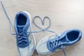 Love sign, Selective focus close up blue sport shoes on gray Royalty Free Stock Photo