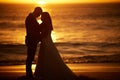 Love, silhouette and couple with beach sunset bond, relax and enjoy quality time, peace and freedom of the ocean sea Royalty Free Stock Photo