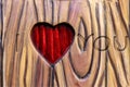 Love simbol in valentines day. heart carved in wood Royalty Free Stock Photo