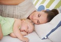 Love, sleeping and mom with baby on bed for bonding, relax and sweet cute relationship. Happy, smile and young mother Royalty Free Stock Photo
