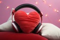 Love songs or podcast concept red heart pillow with headphones