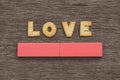 LOVE spelled out with Cookies on the top of a gray wooden board Royalty Free Stock Photo