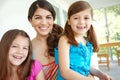 We love spending time with mom. Portrait of a pretty young mother spending time with her two cute daughters. Royalty Free Stock Photo