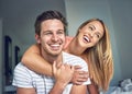 Love starts at home. a happy young couple sharing an affectionate moment in the bedroom at home.