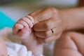 Love starts from little. mother holding her newborn babys hand.