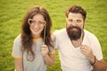 Love story. Happy together. Couple in love cheerful youth booth props. Couple relaxing green lawn. Man bearded hipster