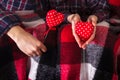 Love story Romance Couple plaid shirts holding red hands two hearts young loving man woman Valentine day Royalty Free Stock Photo