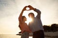 Love Story. Romantic Mature Couple Making Heart Shape With Hands On Sunset Royalty Free Stock Photo