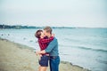 Love story on the sea. Honeymoon. Kiss. Couple in love having happy romantic tender moments on the beach. Boyfriend and girlfriend Royalty Free Stock Photo