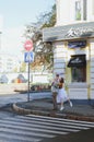 Love story of stylish funny couple: young man in a t-shirt. And a cute young woman in white skirt