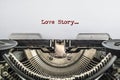 Love story the text is typed on a vintage typewriter, Royalty Free Stock Photo