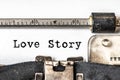 Love story typed words on a vintage typewriter. Close up Royalty Free Stock Photo