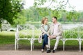 Love story, young couple on bench. Romance relationship Royalty Free Stock Photo