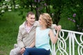 Love story, young couple on bench. Romance relationship Royalty Free Stock Photo