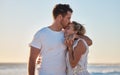 Love, summer and couple kiss at beach for intimacy, romance and loving relationship on honeymoon. Dating, affection and Royalty Free Stock Photo