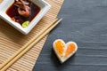 Love sushi abstract menu concept with nigiri heart on black background