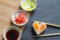 Love sushi abstract menu concept with nigiri heart on black background