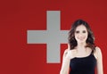 Love Switzerland. Happy woman on swiss flag background Royalty Free Stock Photo