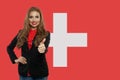 Love Switzerland. Happy woman on swiss flag background Royalty Free Stock Photo