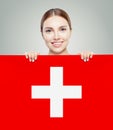 Love Switzerland. Happy woman with swiss flag background. Travel Royalty Free Stock Photo