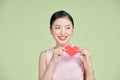 Love symbol. Beautiful girl holding a heart, office manager concept shot