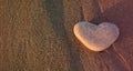 Love symbol. Heart of stone on the pebble beach. Valentine background Royalty Free Stock Photo