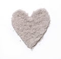 Love Symbol made of Fine Sand. Sandy Heart on a White Background.