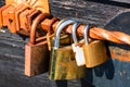 Love symbol, old rusty padlocks hanging on wooden fortress bridge in Alba Iulia, Romania, 2021