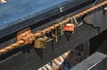 Love symbol, old rusty padlocks hanging on wooden fortress bridge in Alba Iulia, Transylvania, Romania