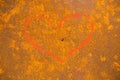 Love symbol painted on background with rust on steel