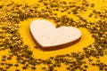 love symbol wooden heart on yellow background, valentines day mothers Day.. Royalty Free Stock Photo