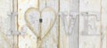 love text with heart shape on wood planks grunge texture background