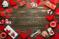 Love, texture with red hearts, candles, gifts for lovers on a wooden background. Valentine`s Day. Flat-lay, top view, copy space Royalty Free Stock Photo