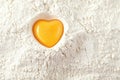 Love to bake it! egg yolk on flour Royalty Free Stock Photo