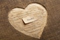 Love to travel concept. Travel - tiny typed text note close up, carved heart shape on wood as a background Royalty Free Stock Photo