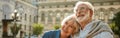 We love to travel together. Happy senior couple bonding to each other and smiling while standing outdoors Royalty Free Stock Photo