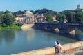 In love tourists couple relaxing on center of Torino Turin, Italy with Vittorio Emanuele I bridge over Po river and the church o Royalty Free Stock Photo