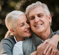 Love, travel and senior couple hug in a forest, happy and bond in nature on a weekend trip together. Smile, face and Royalty Free Stock Photo