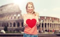 Happy woman or teen girl with red heart shape Royalty Free Stock Photo