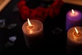 Love triangle and broken relationship concept. Broken glass  and three burning candles on black background Royalty Free Stock Photo