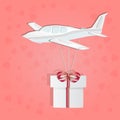 Small airplane with gift box isolated on pink background. Paper cut design.