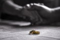 Love, Valentine`s day and wedding concept. Two wedding rings with man and woman hands blurred in the background. Selective focus Royalty Free Stock Photo