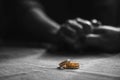 Love, Valentine`s day and wedding concept. Two wedding rings with man and woman hands blurred in the background. Selective focus Royalty Free Stock Photo