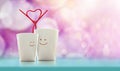 Love and Valentines Day Concept. Happy Lover Coffee Cup with smiley face and Straw in Heart Shape, Happiness and Romantic