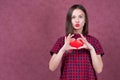 Love and valentines day woman holding heart smiling cute and adorable isolated on pink background Royalty Free Stock Photo