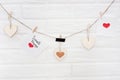 Love valentines garland with brick wall on a background. Wise phrase `small things` Royalty Free Stock Photo