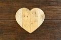 Love Valentines wooden heart on rough driftwood background Royalty Free Stock Photo