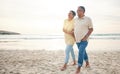 Love, walking and senior couple at the beach happy, relax and bond in nature together. Ocean, embrace and old people at