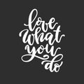 Love what you do calligraphic inscription. Vector white text on black background Royalty Free Stock Photo