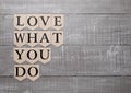 Love what you do motivation symbol on wood board